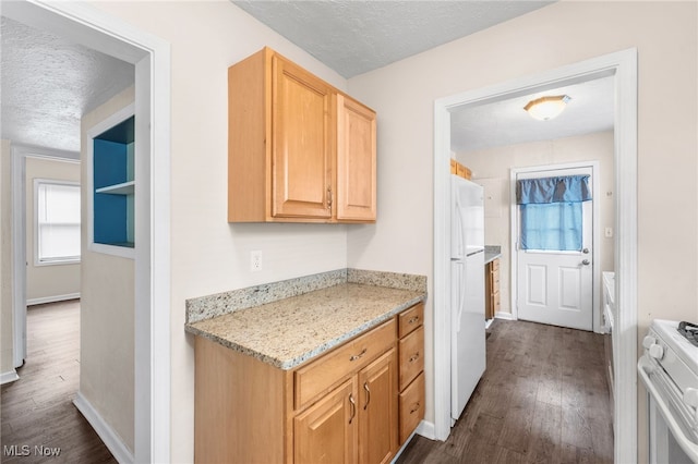 907 Hillsdale Ave, Parma, OH 44134 - kitchen with white appliances, a textured ceiling, dark wood-style flooring, light stone countertops, and light brown cabinets