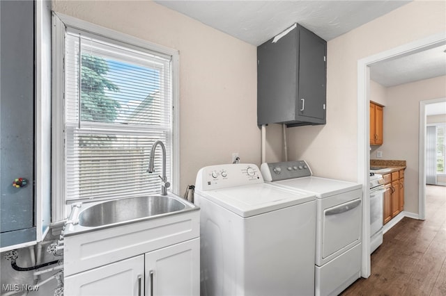 907 Hillsdale Ave, Parma, OH 44134 - laundry area with cabinet space, independent washer and dryer, and wood finished floors