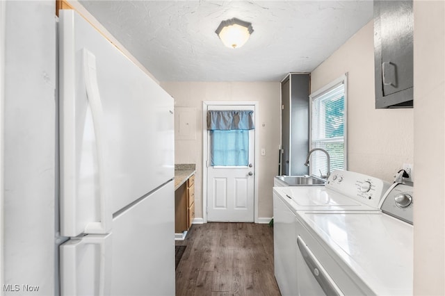 907 Hillsdale Ave, Parma, OH 44134 - laundry area featuring washing machine and clothes dryer, dark wood-style floors, and cabinet space