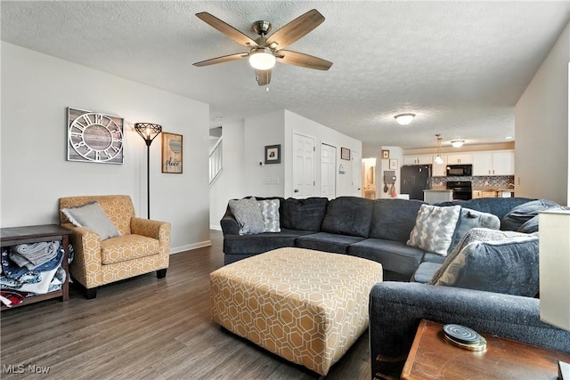 3990 Abigail Dr, Lorain, OH 44053 - living area with dark wood-style flooring, ceiling fan, a textured ceiling, and stairway