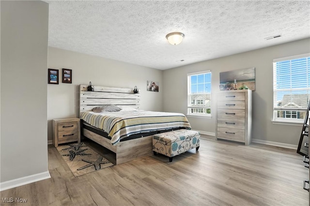 3990 Abigail Dr, Lorain, OH 44053 - bedroom featuring wood finished floors and a textured ceiling