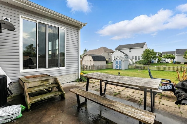 3990 Abigail Dr, Lorain, OH 44053 - fenced backyard with a shed, a residential view, and a patio