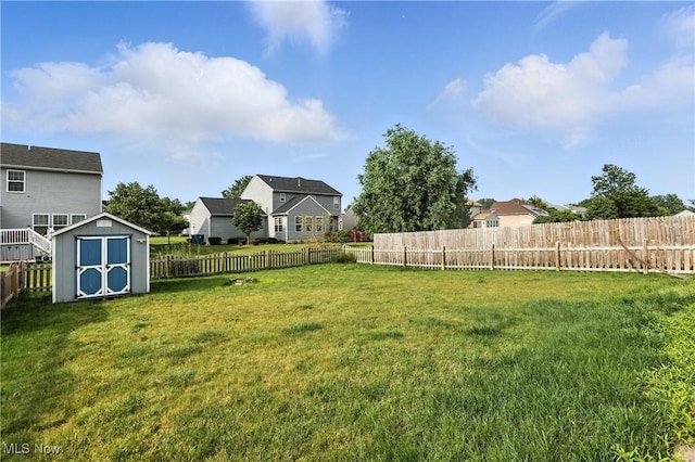 3990 Abigail Dr, Lorain, OH 44053 - fenced backyard featuring a storage unit