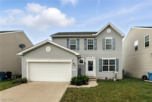 3990 Abigail Dr, Lorain, OH 44053 - view of front facade with concrete driveway, a garage, and a front yard