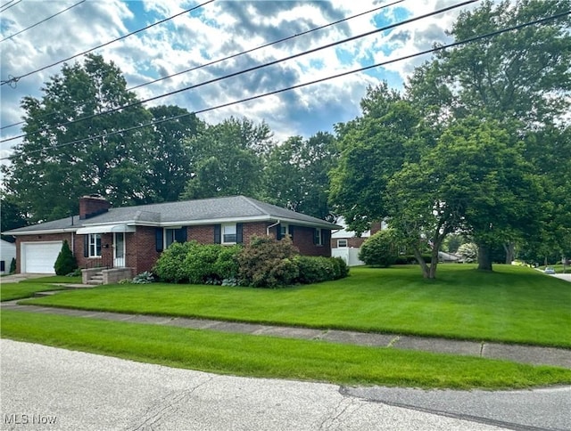 344 17th St NW, Barberton, OH 44203 - single story home featuring brick siding, a garage, a front lawn, and a chimney