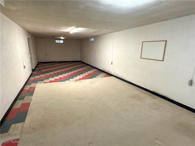 344 17th St NW, Barberton, OH 44203 - below grade area featuring baseboards and carpet flooring