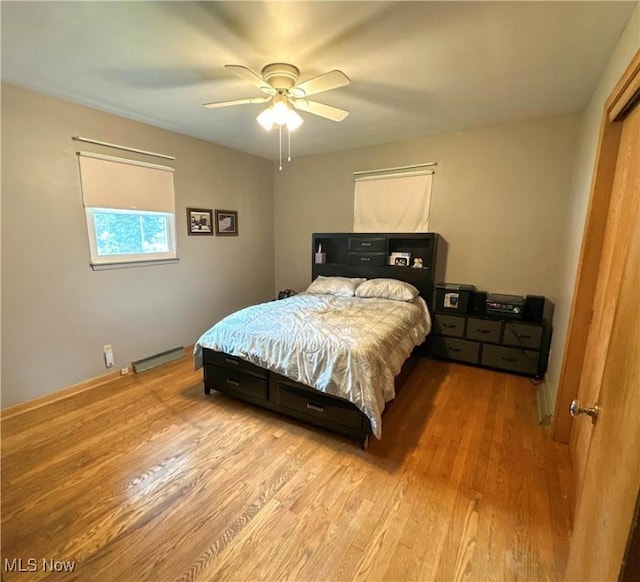 344 17th St NW, Barberton, OH 44203 - bedroom with wood finished floors and ceiling fan