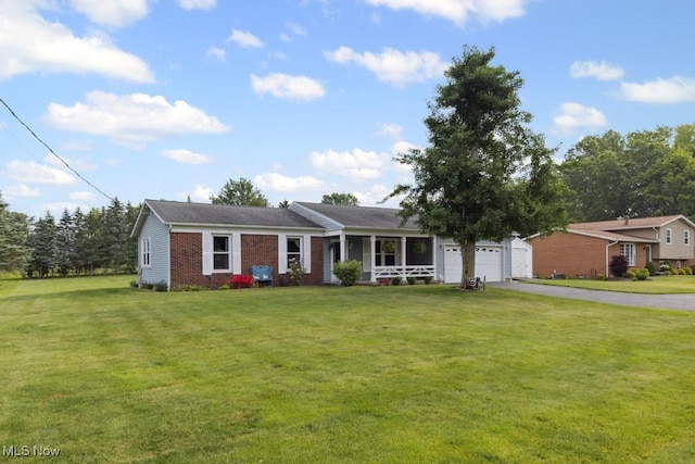 1114 Beechwood Rd, Salem, OH 44460 - ranch-style house featuring brick siding, asphalt driveway, a garage, a front lawn, and a porch