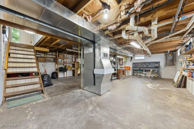 1114 Beechwood Rd, Salem, OH 44460 - basement with electric panel, stairway, plenty of natural light, and heating unit