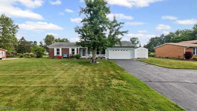 1114 Beechwood Rd, Salem, OH 44460 - ranch-style home featuring driveway, a garage, and a front lawn