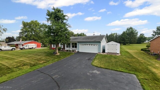 1114 Beechwood Rd, Salem, OH 44460 - view of front of home with a front yard, an attached garage, and asphalt driveway