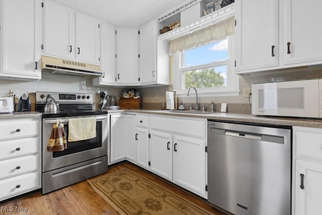 1114 Beechwood Rd, Salem, OH 44460 - kitchen with stainless steel appliances, under cabinet range hood, and white cabinets