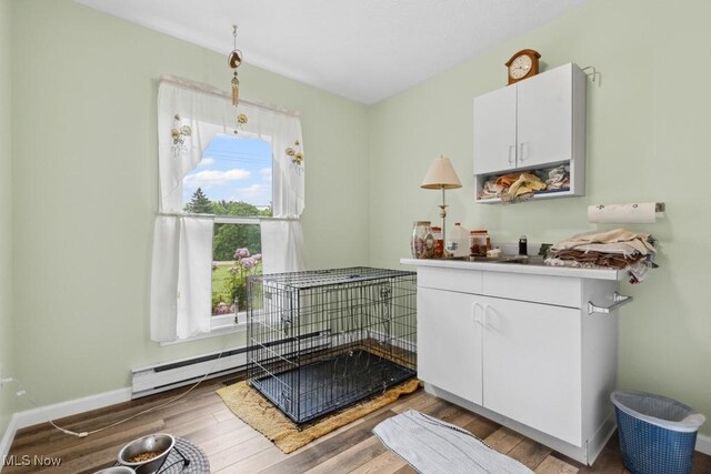 1114 Beechwood Rd, Salem, OH 44460 - dining area featuring wood finished floors and a baseboard heating unit