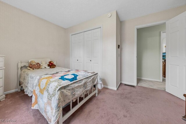 1114 Beechwood Rd, Salem, OH 44460 - bedroom featuring a closet, carpet flooring, and wallpapered walls