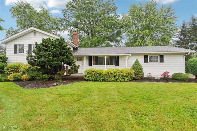 7375 Som Center Rd, Solon, OH 44139 - view of front of home with a chimney and a front yard