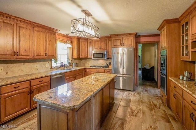 3020 Crookston Ln, Clinton, OH 44216 - kitchen with appliances with stainless steel finishes, brown cabinets, decorative backsplash, glass insert cabinets, and a center island