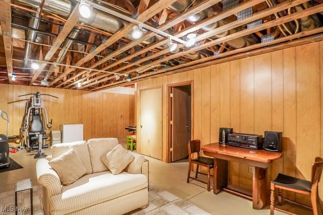 3020 Crookston Ln, Clinton, OH 44216 - living room with wooden walls and concrete floors
