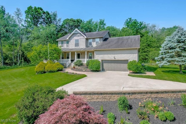 3020 Crookston Ln, Clinton, OH 44216 - colonial home featuring a porch, a front yard, driveway, and a garage