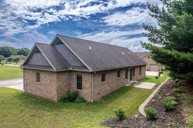 116 Falling Waters Dr, Vienna, WV 26105 - view of side of home with a yard, brick siding, and a patio