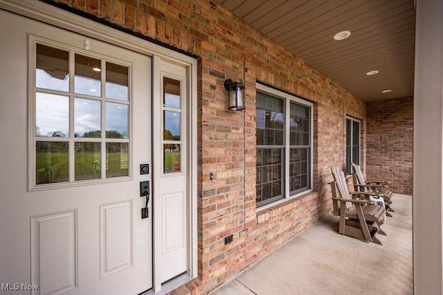 116 Falling Waters Dr, Vienna, WV 26105 - doorway to property with covered porch and brick siding