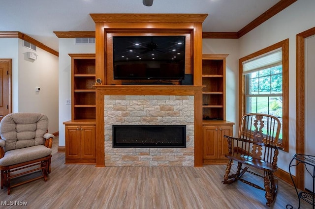 116 Falling Waters Dr, Vienna, WV 26105 - living area with light wood-style flooring, crown molding, and a fireplace