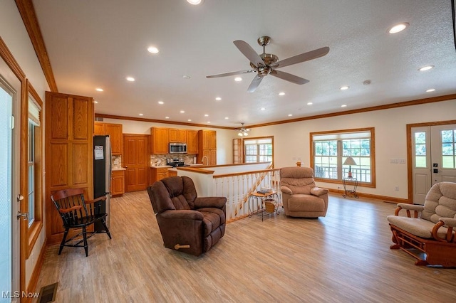 116 Falling Waters Dr, Vienna, WV 26105 - living area featuring light wood-style flooring, crown molding, recessed lighting, healthy amount of natural light, and ceiling fan