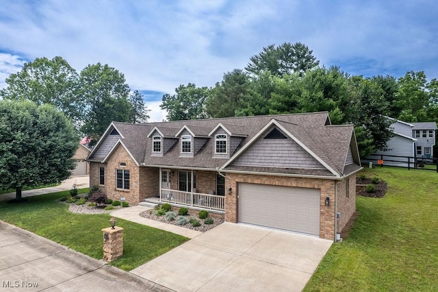 116 Falling Waters Dr, Vienna, WV 26105 - view of front of house featuring brick siding, covered porch, driveway, and a front lawn