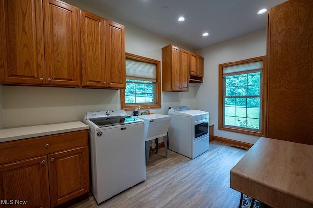 116 Falling Waters Dr, Vienna, WV 26105 - washroom with cabinet space, washer and dryer, light wood-type flooring, and recessed lighting