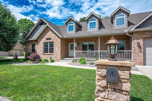 116 Falling Waters Dr, Vienna, WV 26105 - view of front of property with a porch, brick siding, a front yard, and a shingled roof