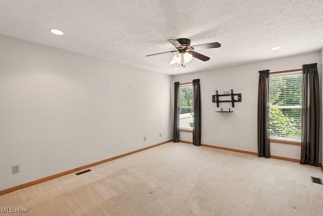 1367 Hidden Lake Blvd, Akron, OH 44312 - unfurnished room with ceiling fan, light colored carpet, a textured ceiling, and recessed lighting