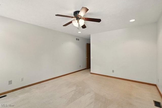 1367 Hidden Lake Blvd, Akron, OH 44312 - spare room with a ceiling fan, light colored carpet, and recessed lighting