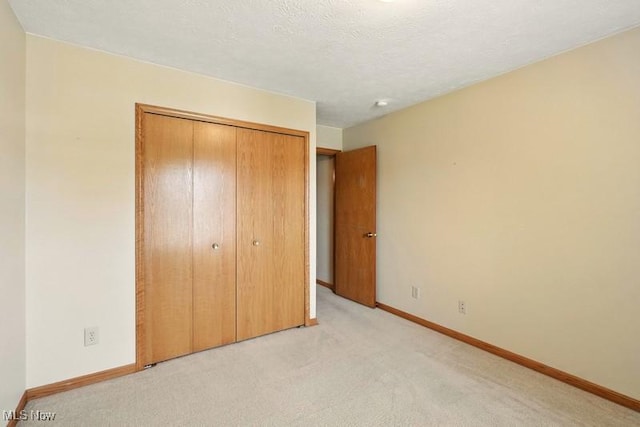 1367 Hidden Lake Blvd, Akron, OH 44312 - unfurnished bedroom featuring a closet and light carpet