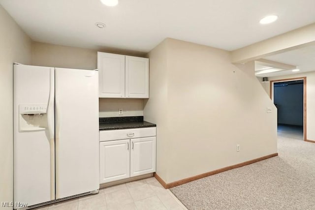 1367 Hidden Lake Blvd, Akron, OH 44312 - kitchen with white refrigerator with ice dispenser, white cabinetry, dark countertops, and recessed lighting