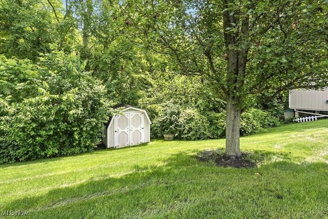 1367 Hidden Lake Blvd, Akron, OH 44312 - view of grassy yard with a storage unit
