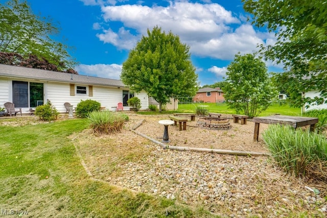 1260 Pleasant Ridge St SE, Minerva, OH 44657 - view of grassy yard featuring a fire pit