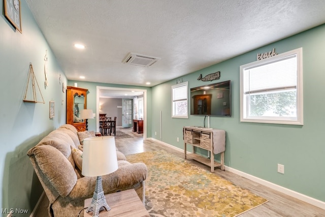 1260 Pleasant Ridge St SE, Minerva, OH 44657 - living area featuring a textured ceiling, recessed lighting, and wood finished floors