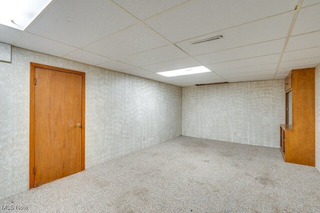 1260 Pleasant Ridge St SE, Minerva, OH 44657 - finished below grade area featuring carpet, a paneled ceiling, and wallpapered walls