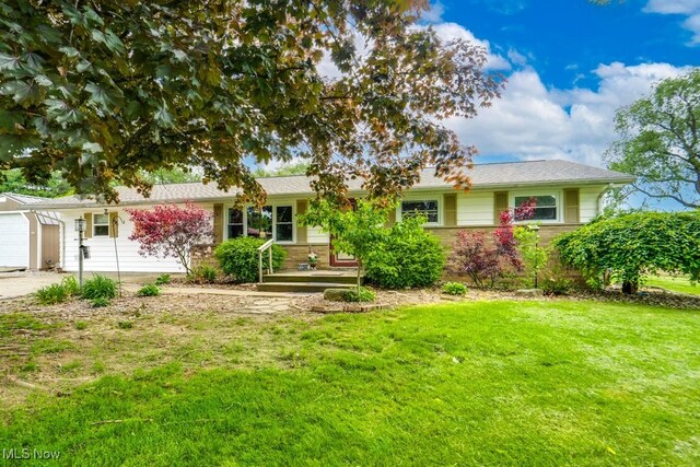 1260 Pleasant Ridge St SE, Minerva, OH 44657 - single story home with a front lawn and a garage