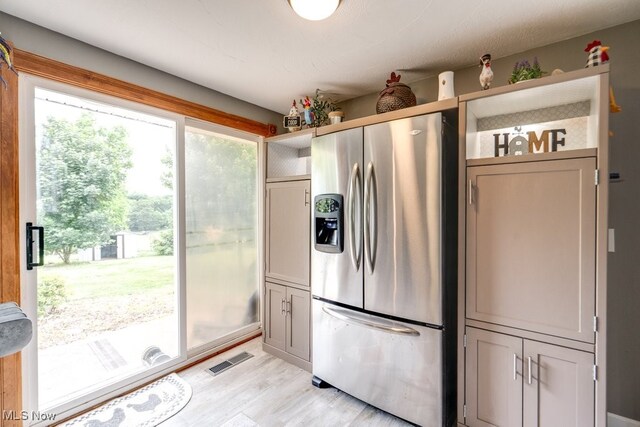 1260 Pleasant Ridge St SE, Minerva, OH 44657 - kitchen with stainless steel fridge with ice dispenser and light wood-style flooring