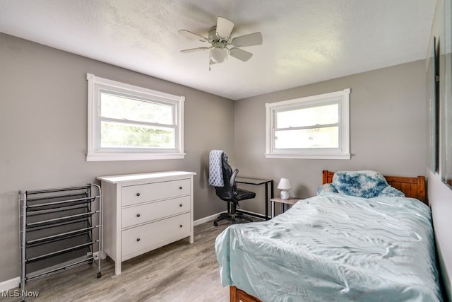 1260 Pleasant Ridge St SE, Minerva, OH 44657 - bedroom featuring light wood finished floors and ceiling fan