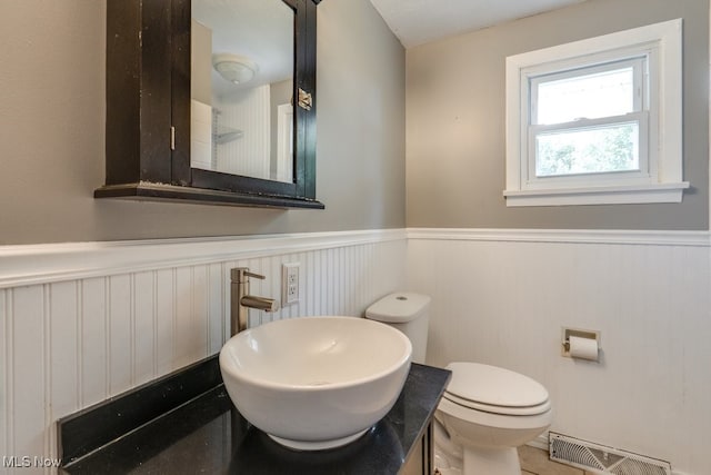 1260 Pleasant Ridge St SE, Minerva, OH 44657 - bathroom with wainscoting and vanity