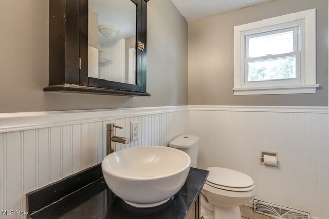 1260 Pleasant Ridge St SE, Minerva, OH 44657 - bathroom with a wainscoted wall and vanity