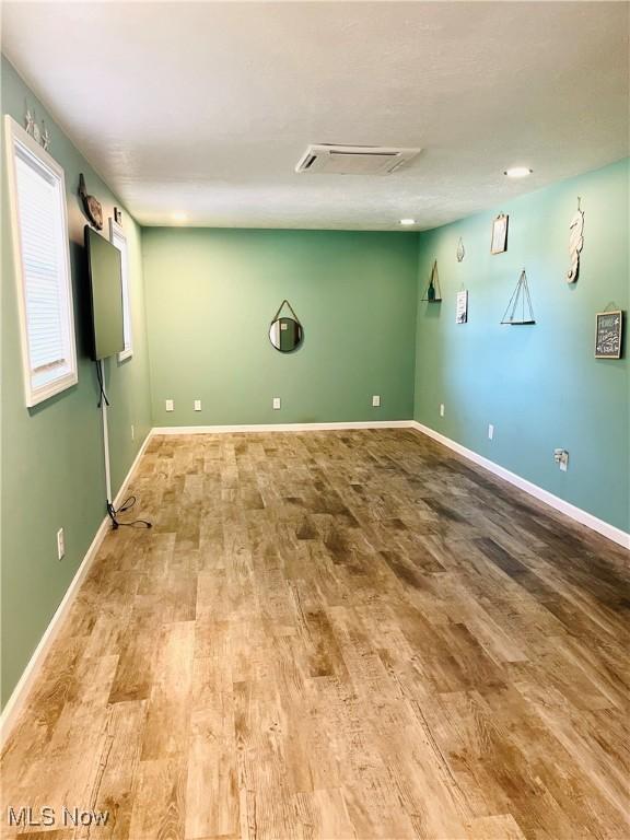 1260 Pleasant Ridge St SE, Minerva, OH 44657 - empty room with wood finished floors and baseboards