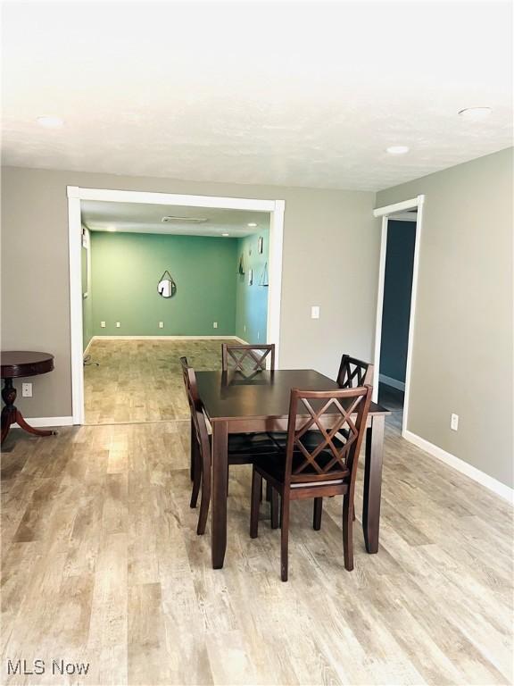 1260 Pleasant Ridge St SE, Minerva, OH 44657 - dining area featuring light wood finished floors