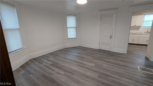 916 6th St NW, Canton, OH 44703 - unfurnished dining area featuring dark wood-style flooring