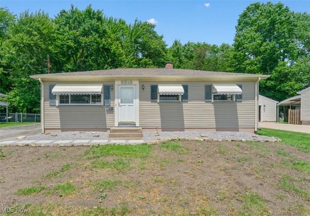 5318 Pinecrest Ave, Youngstown, OH 44515 - view of front of home featuring a chimney and entry steps