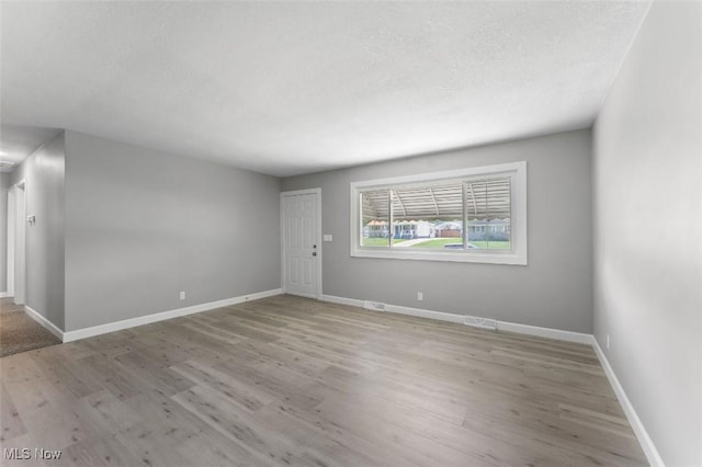 5318 Pinecrest Ave, Youngstown, OH 44515 - unfurnished room with wood finished floors and a textured ceiling