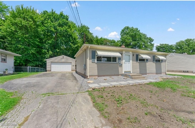 5318 Pinecrest Ave, Youngstown, OH 44515 - view of front facade with a garage and an outbuilding