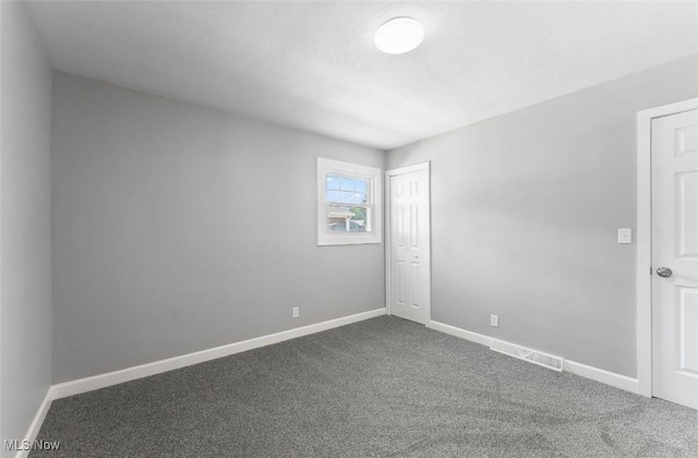 5318 Pinecrest Ave, Youngstown, OH 44515 - unfurnished room with dark carpet and baseboards