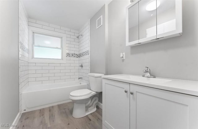 5318 Pinecrest Ave, Youngstown, OH 44515 - full bathroom featuring wood finished floors, vanity, and  shower combination